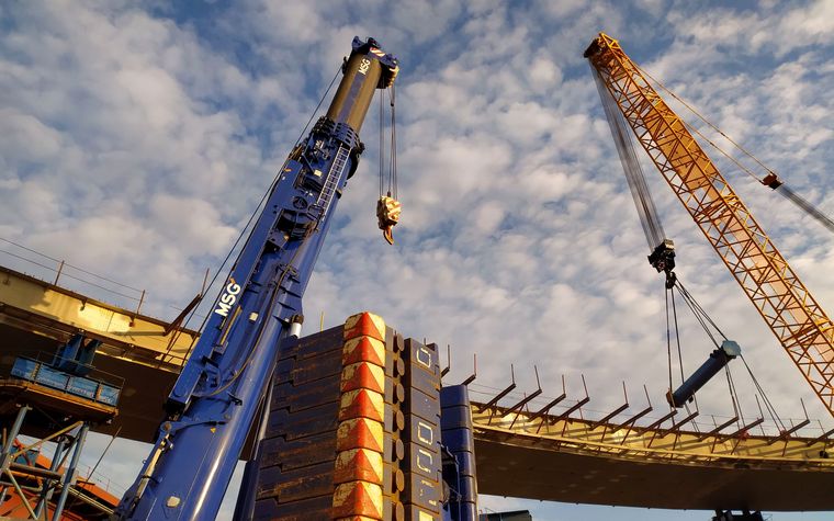 Tower cranes and structural steel on a large construction site