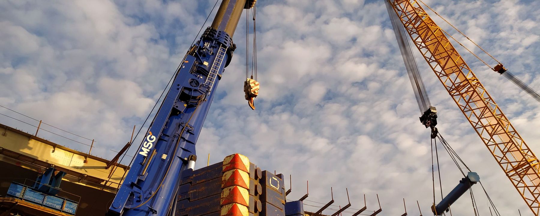 Tower cranes and structural steel on a large construction site
