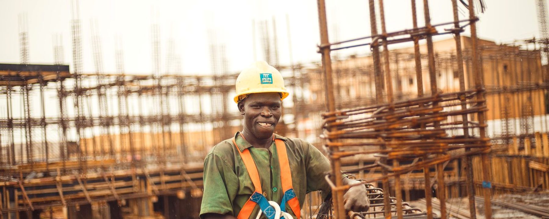 Site worker in a full body harness on a reinforced concrete deck